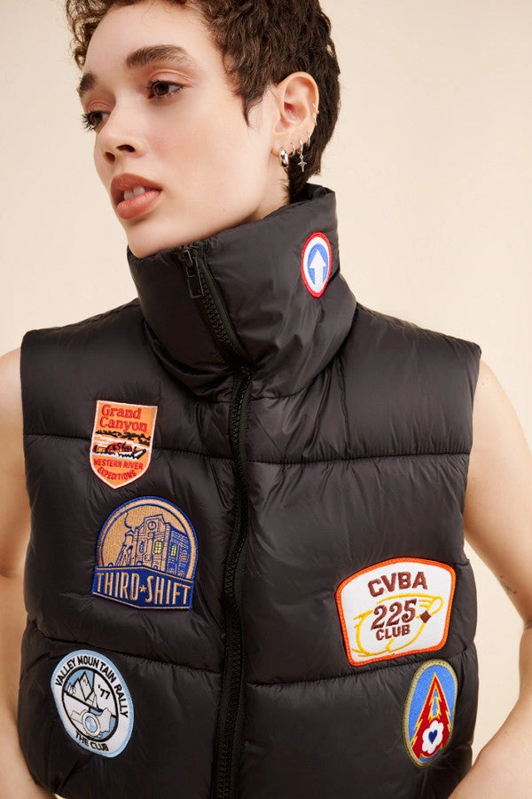 Ready to Brave the Elements? – The Perfectly Patched Puffer Vest.